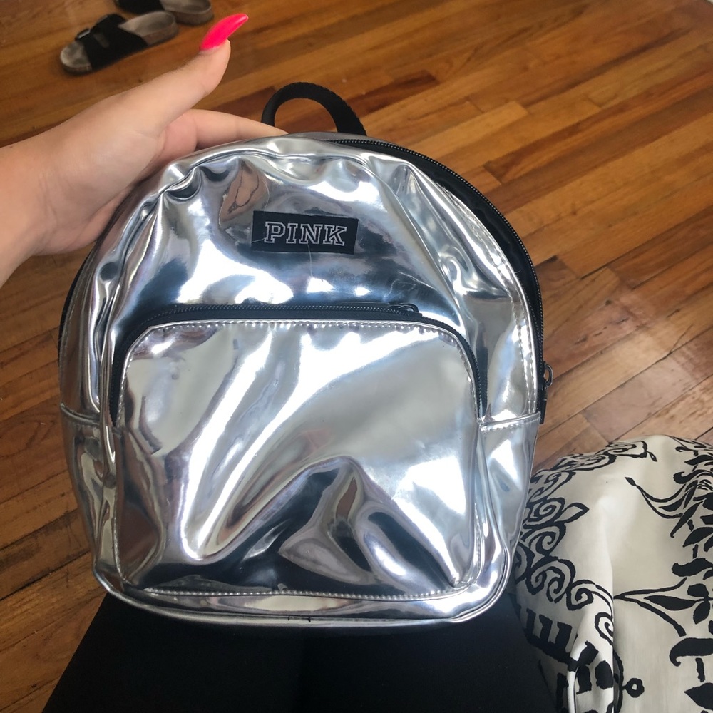 metallic PINK mini bookbag 👀